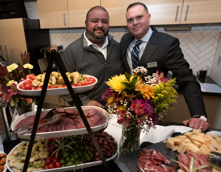 Barry Winfree behind a counter full of food